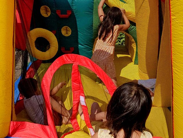 Children playing in a bounce castle