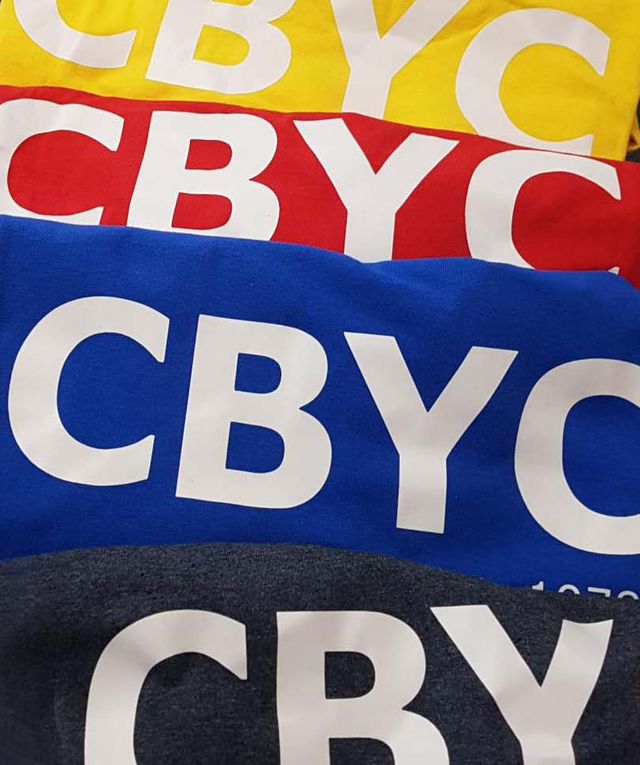 CBYC flags in yellow, red, blue and black