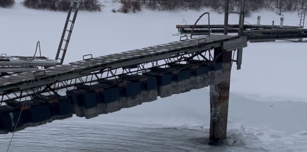 Docks locked in ice and snow in winter